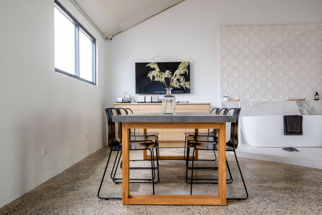 Stylish dining area showcasing a modern table and matching chairs in a bright setting.