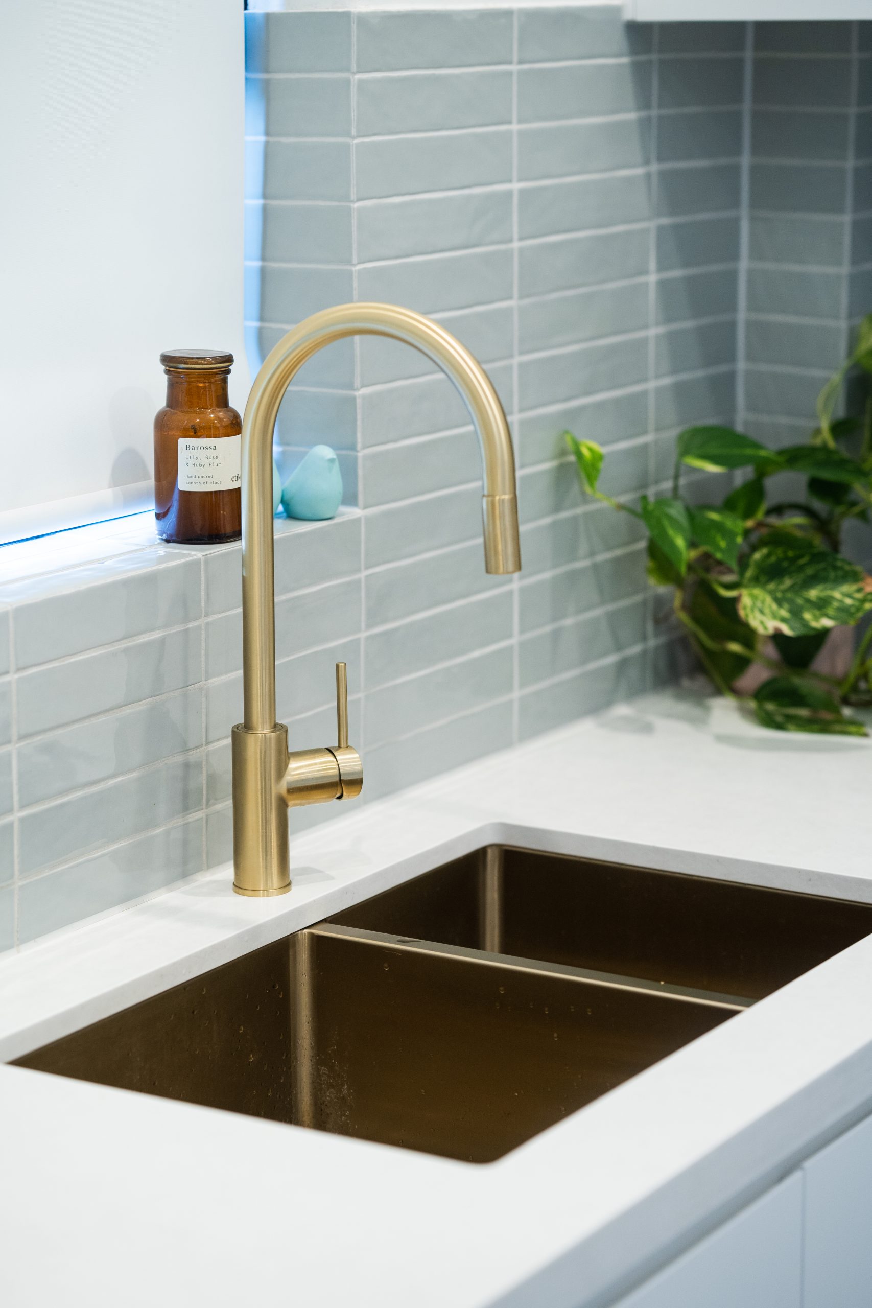 Golden kitchen mixer on a white benchtop